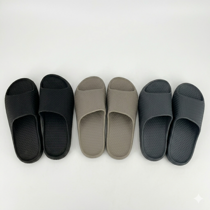 Three pairs of black, gray, and dark gray slides on a white background