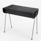 Black portable grill with metal legs on a white background