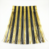 black and gold fringe skirt on a white background