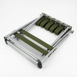Metal folding chair with green straps on a white background